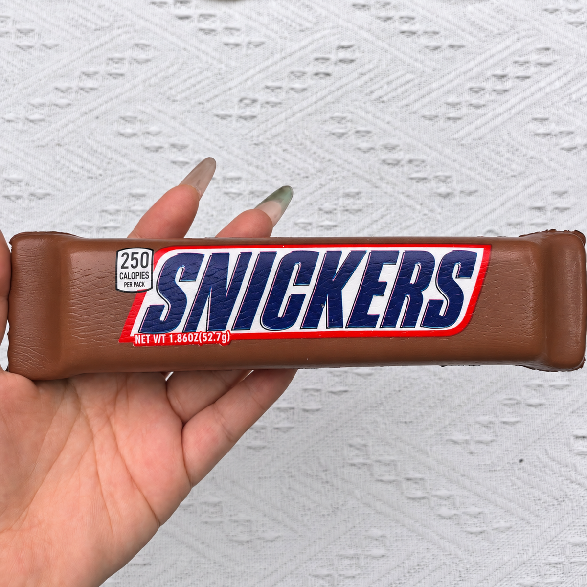 Chocolate bar PU foam squishy product photo. Set includes three squishies; decorative props not included.