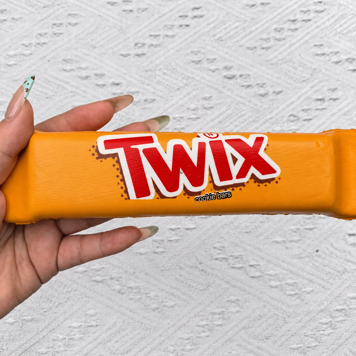 Chocolate bar PU foam squishy product photo. Set includes three squishies; decorative props not included.