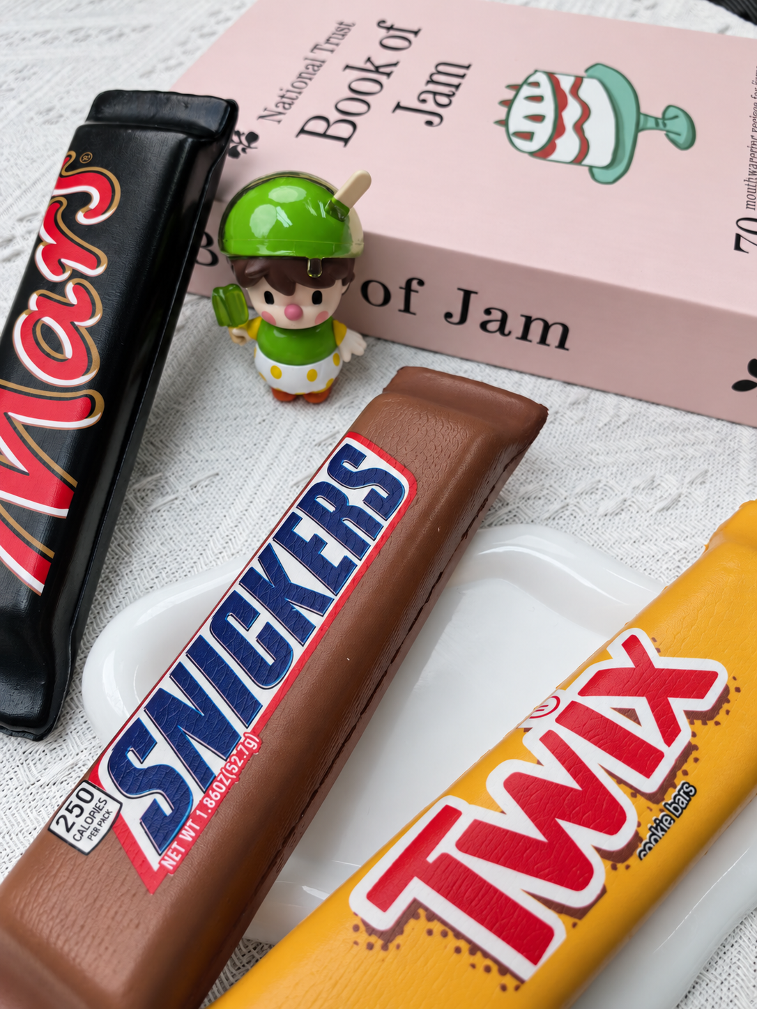 Chocolate bar PU foam squishy product photo. Set includes three squishies; decorative props not included.