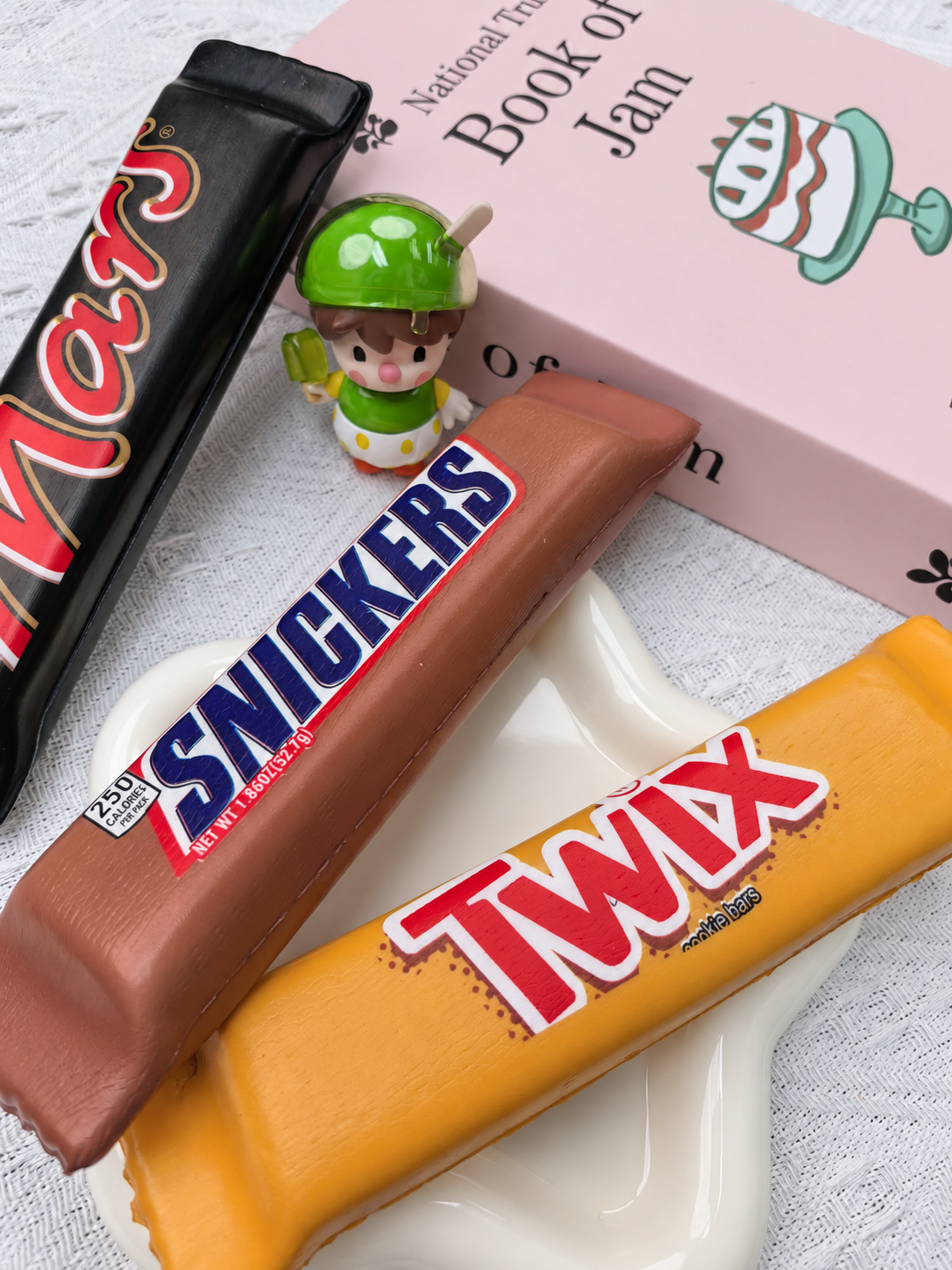 Chocolate bar PU foam squishy product photo. Set includes three squishies; decorative props not included.
