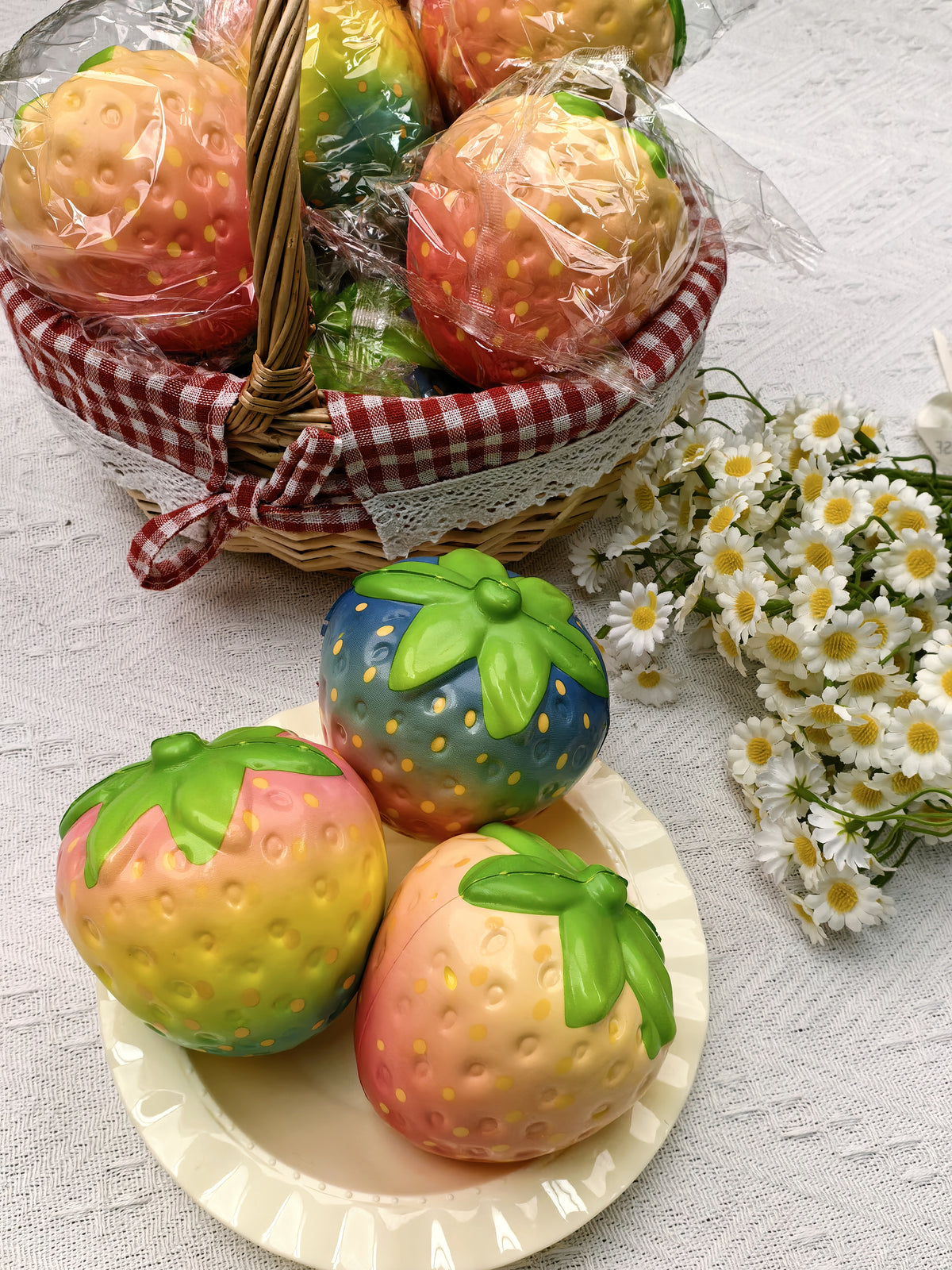 Assorted colorful strawberry squishies in a styled display; choose Single or 12-Piece Box