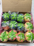 12-piece box of individually wrapped colorful strawberry squishies