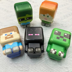 Five block-style squishy figures, close-up group view.