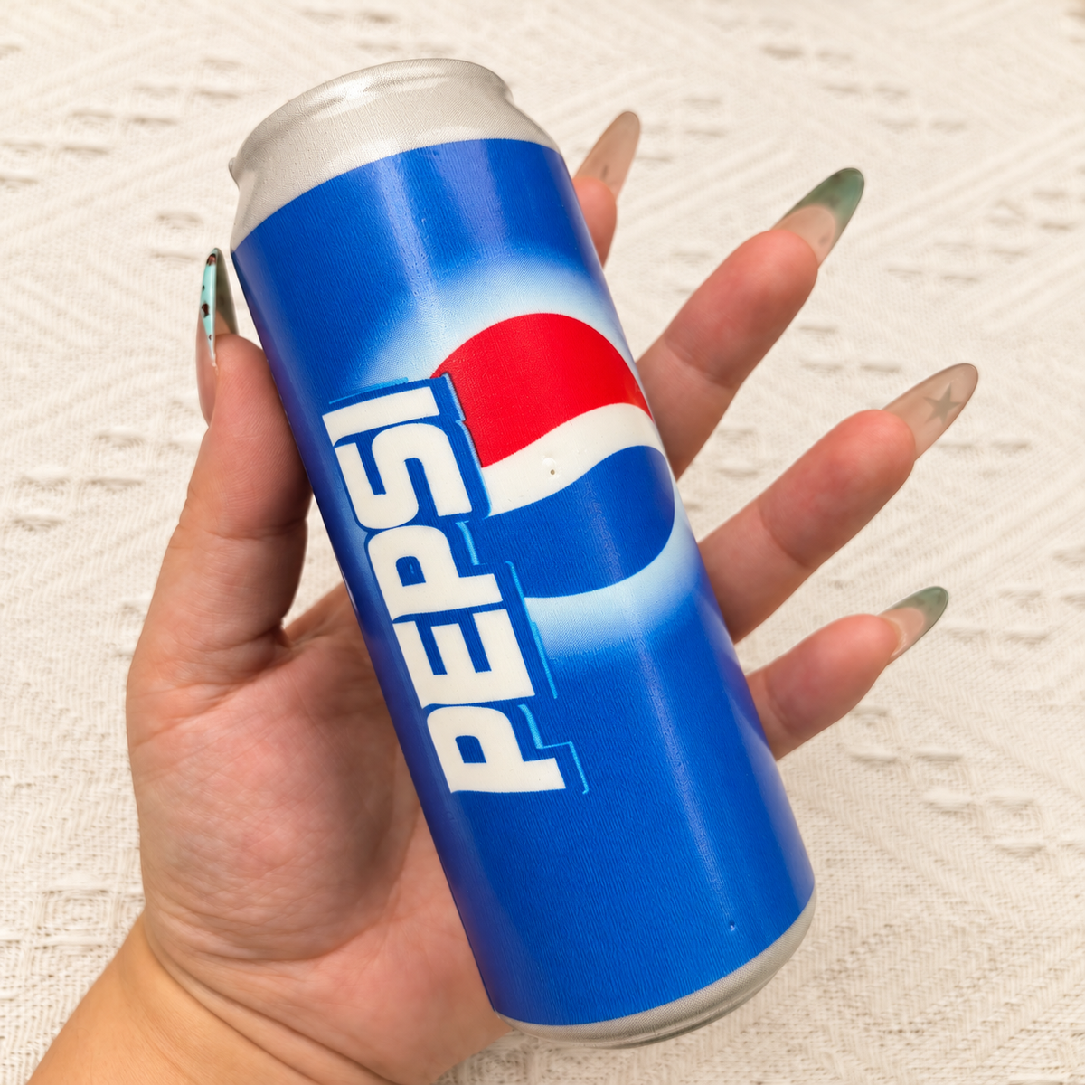 Soda can squishy product photo, warm natural lighting