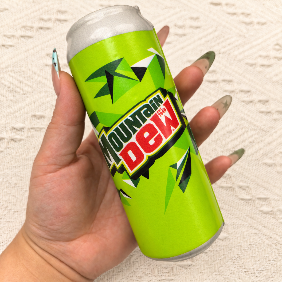Soda can squishy product photo, warm natural lighting