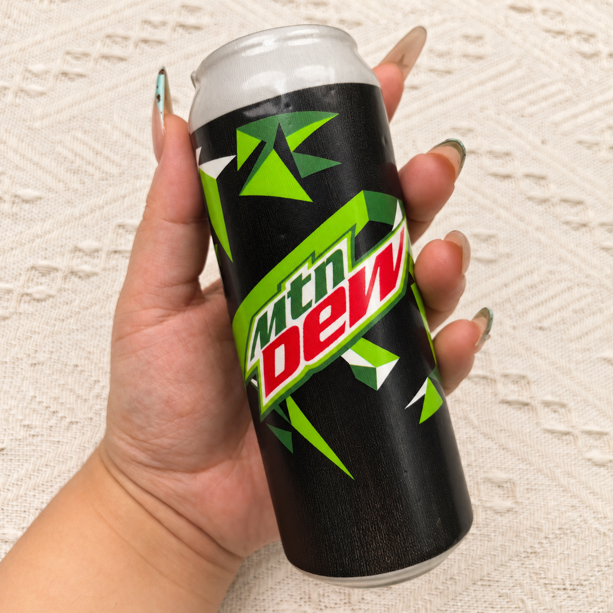 Soda can squishy product photo, warm natural lighting
