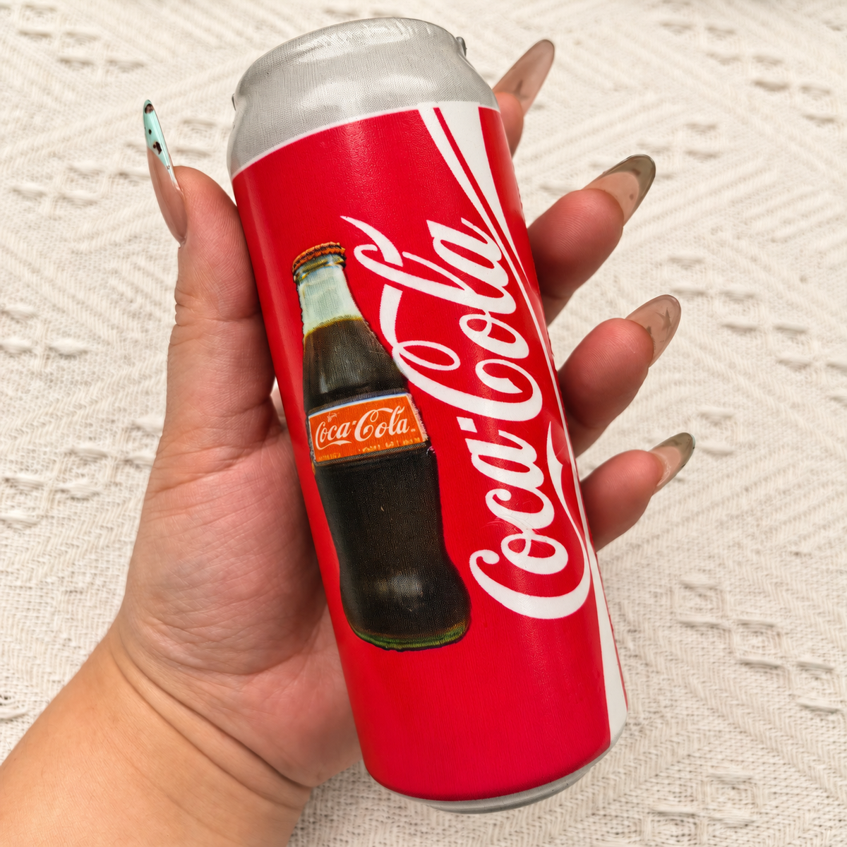 Soda can squishy product photo, warm natural lighting